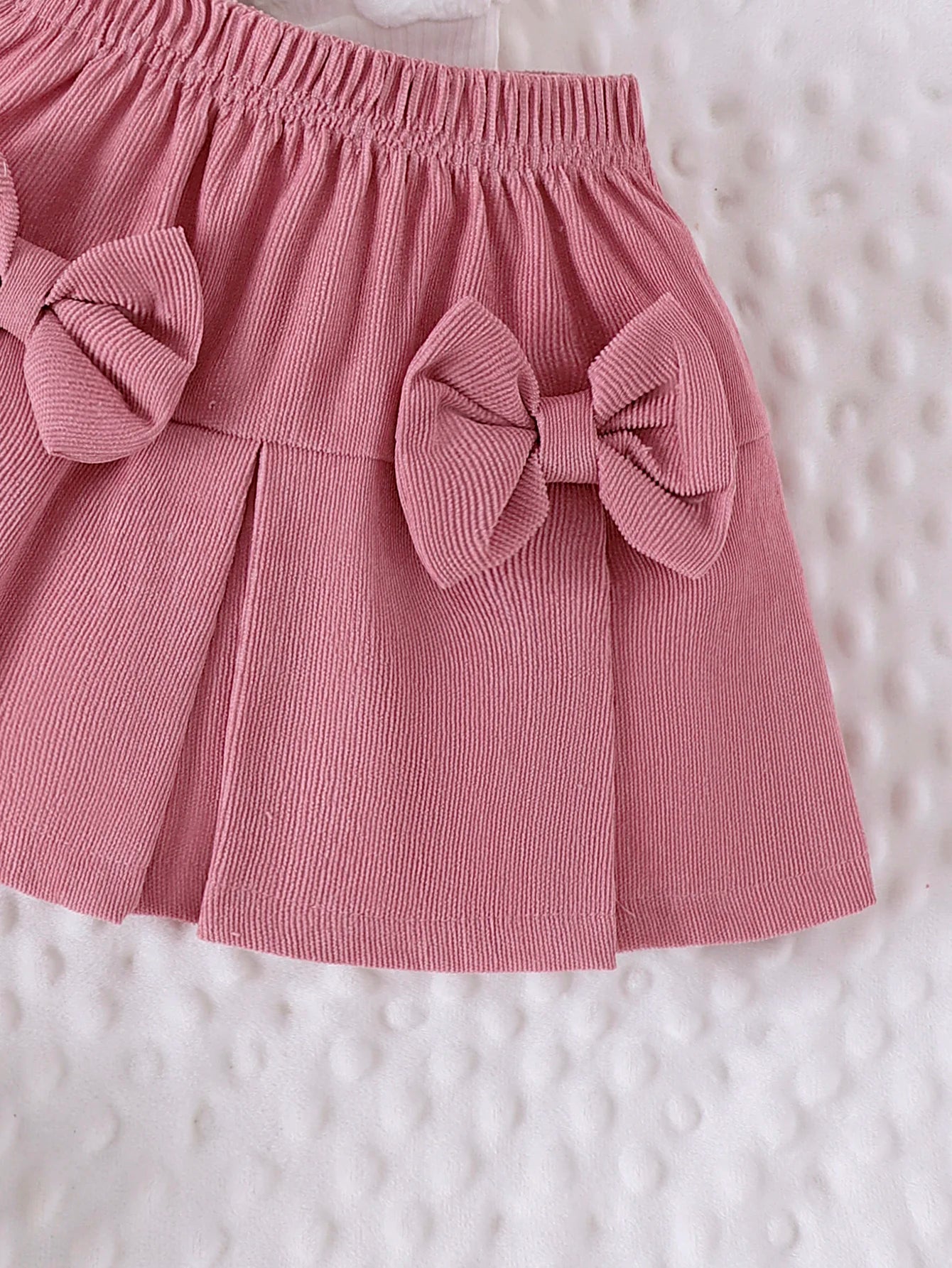 Conjunto Infantil Blusa Coração e Saia com Laços – Charme e Conforto para Pequenas Fashionistas