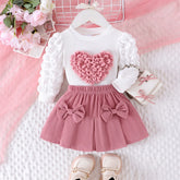 Conjunto Infantil Blusa Coração e Saia com Laços – Charme e Conforto para Pequenas Fashionistas
