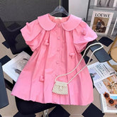Vestido Infantil Rosa com Aplicações de Coração e Bolsa de Pérolas