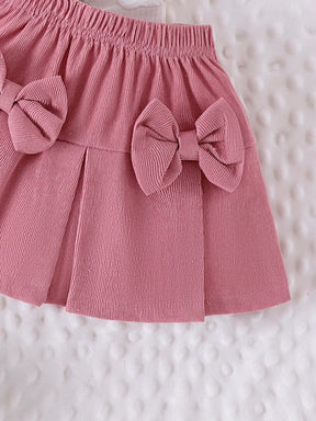 Conjunto Infantil Blusa Coração e Saia com Laços – Charme e Conforto para Pequenas Fashionistas