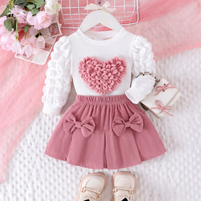 Conjunto Infantil Blusa Coração e Saia com Laços – Charme e Conforto para Pequenas Fashionistas