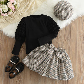 Conjunto Infantil Inverno Xadrez com Blusa Preta de Manga Longa e Saia com Laço